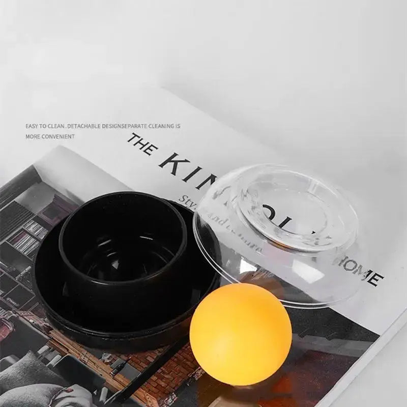 Round money-counting case set of 3 by Simples Market with black inner bowl, orange ball, and clear lid