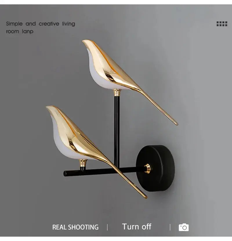 Modern LED wall lamp with two gold magpie bird sconces on a black metal wall mount