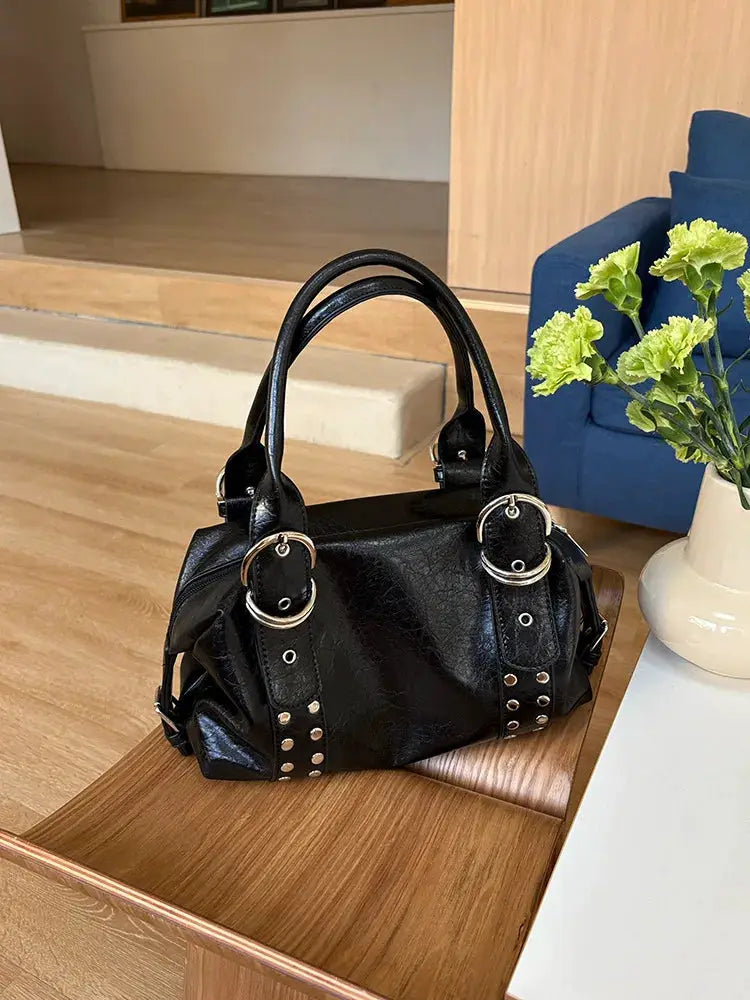 Black PU leather rivet shoulder bag with dual handles and silver-tone metal rings