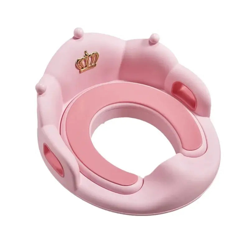 Baby toilet seat ring in pink with cushioned inner ring and crown emblem, a safe, child-friendly bathroom aid.