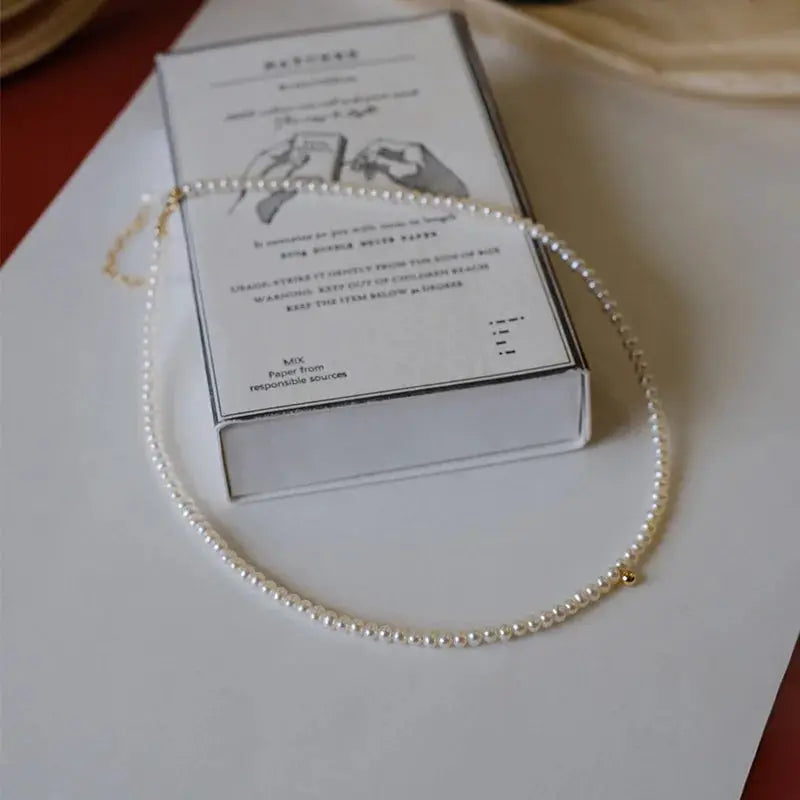 Imitation pearl necklace, white collarbone-length with gold clasp, Simples Market