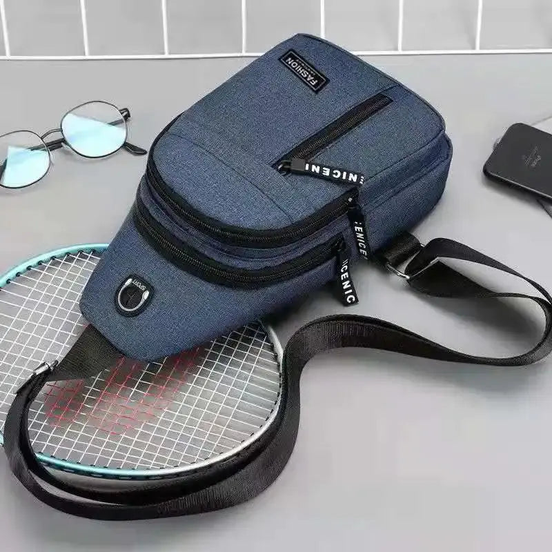 Blue Oxford chest bag with dual zipper pockets and adjustable crossbody strap