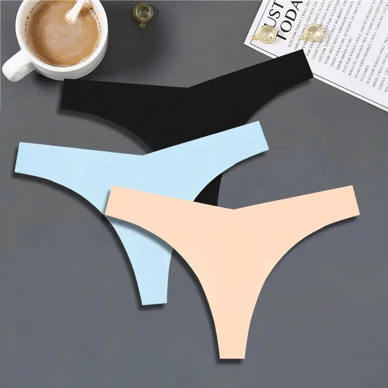 Three-piece FINETOO ice-silk seamless low-rise thong panty set in black, light blue, and peach.