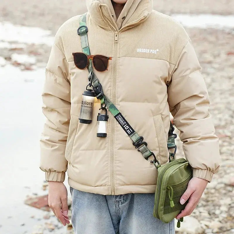 Outdoor multi-functional crossbody strap for backpacks; green camouflage strap with olive pouch and attached accessories.