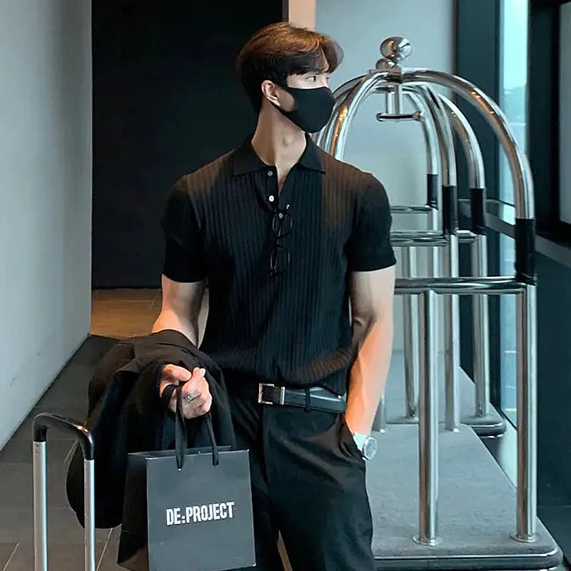 Polo shirt, men's black ribbed-knit short-sleeve with polo collar.
