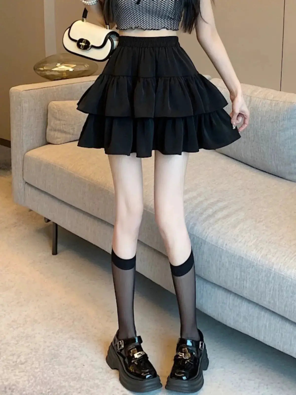Black tiered mini A-line skirt with high-waist ruffles