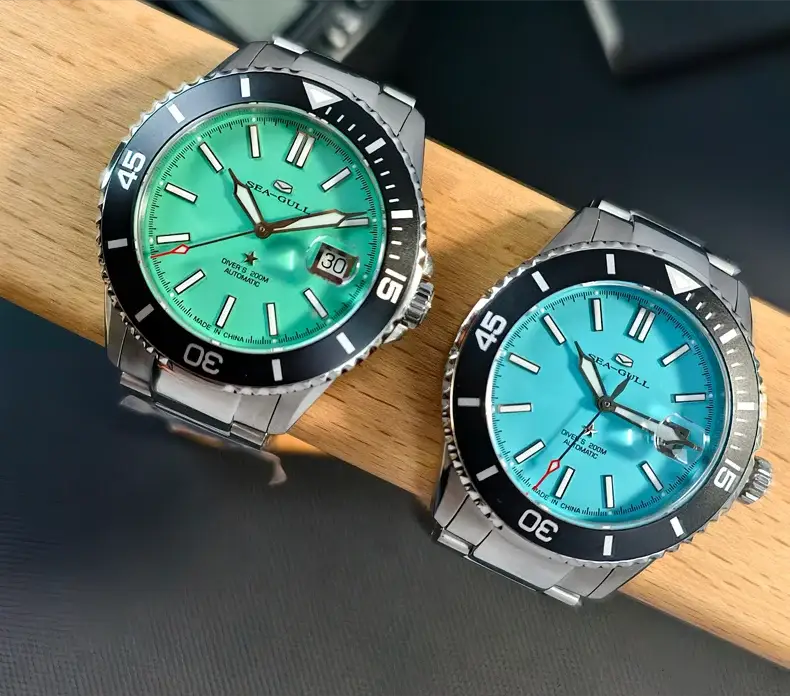 Sea-Gull men's diver watch pair with teal and blue dials, automatic movement, stainless steel bands, 200m water resistant