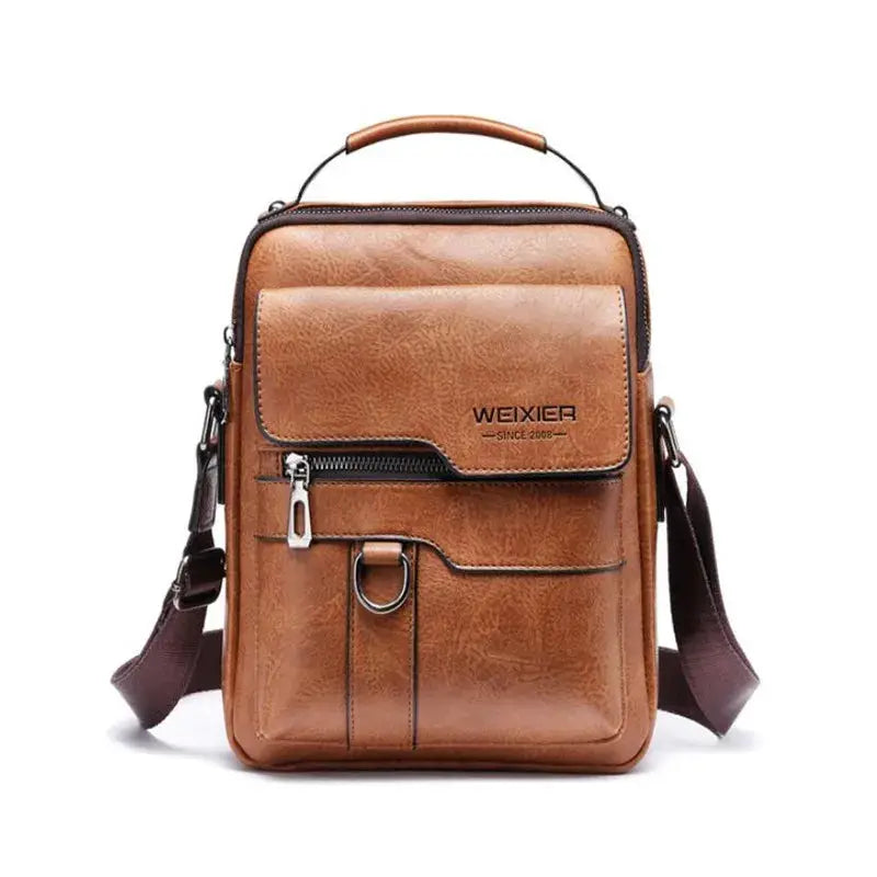 Brown leather men's crossbody bag with front zip pocket, ring detail, top handle, and adjustable strap (WEIXIER).