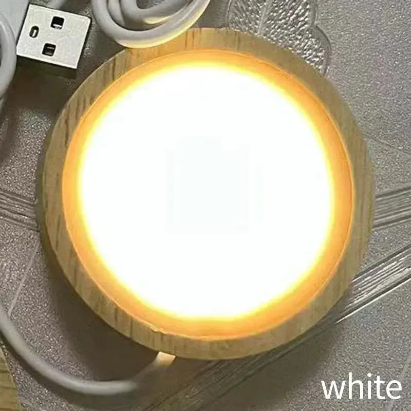 Round wooden LED night light base with warm glow and USB cable Simples Market