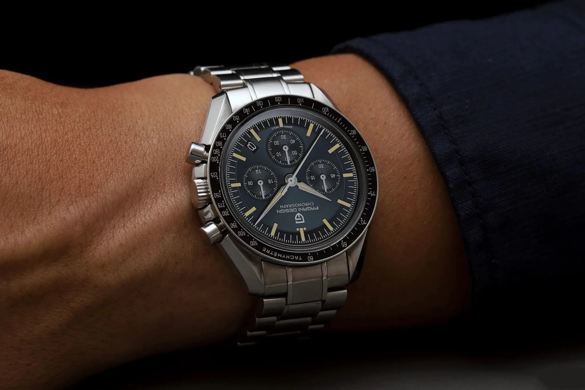 Pagani Design moon watch chronograph on wrist; stainless steel band, black tachymeter bezel