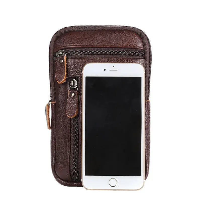 Brown genuine leather waist pack with multiple zippers and a front phone pocket.