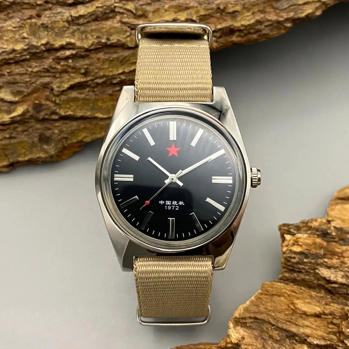 Mens mechanical watch with black dial, red star, 36mm, beige canvas strap.