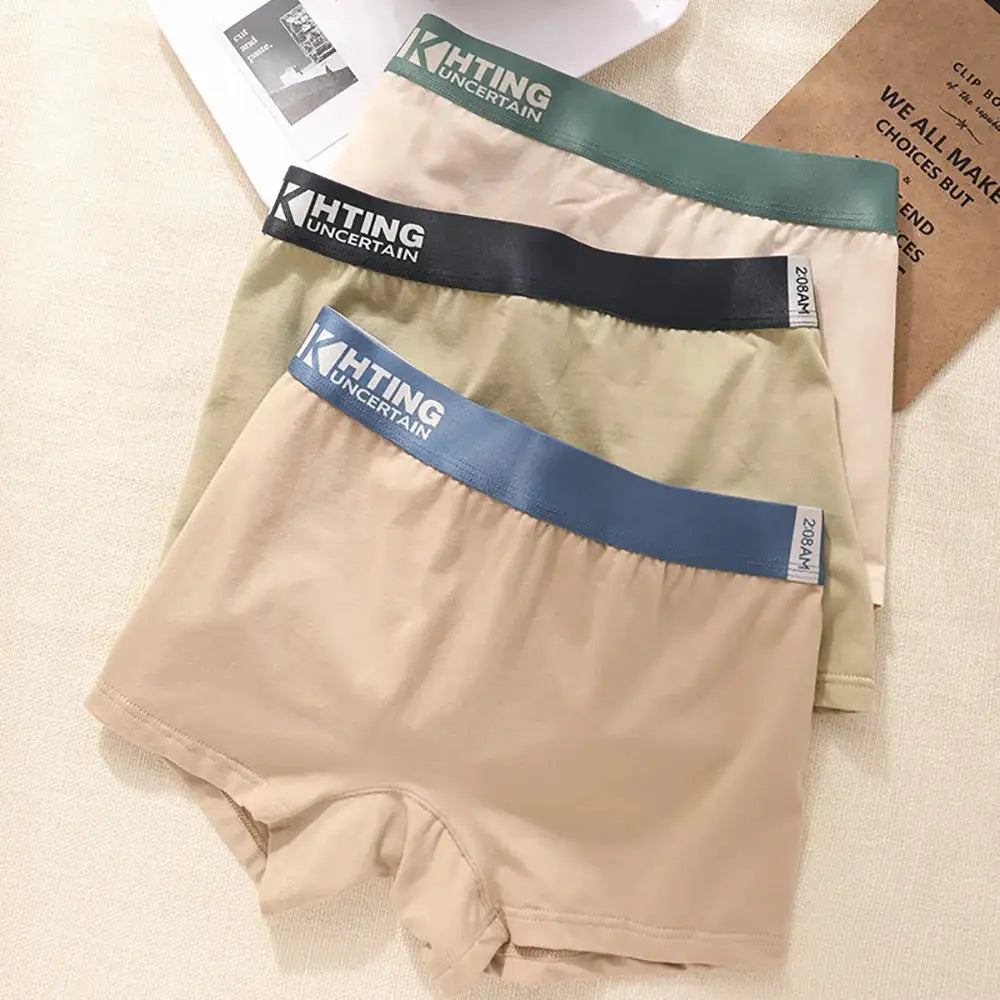 4-pack women's 100% cotton antibacterial panties with high-elastic waistbands; beige bases with green, black, blue, and light-blue waistbands, KHTING branding