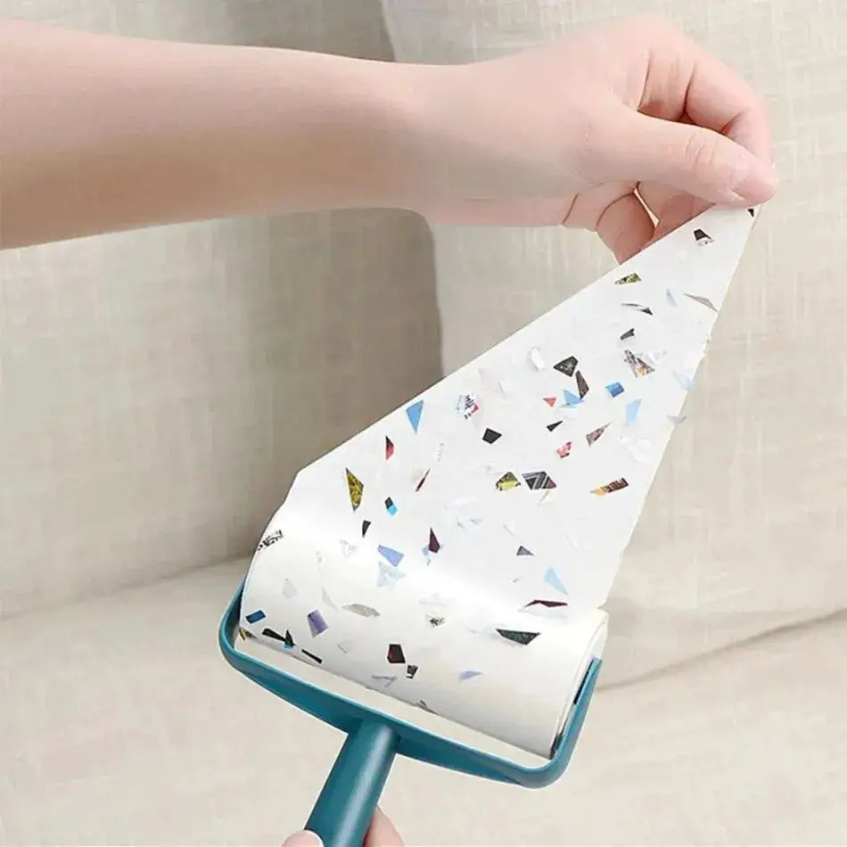 Pet hair remover lint roller with teal handle and tearable paper sheets