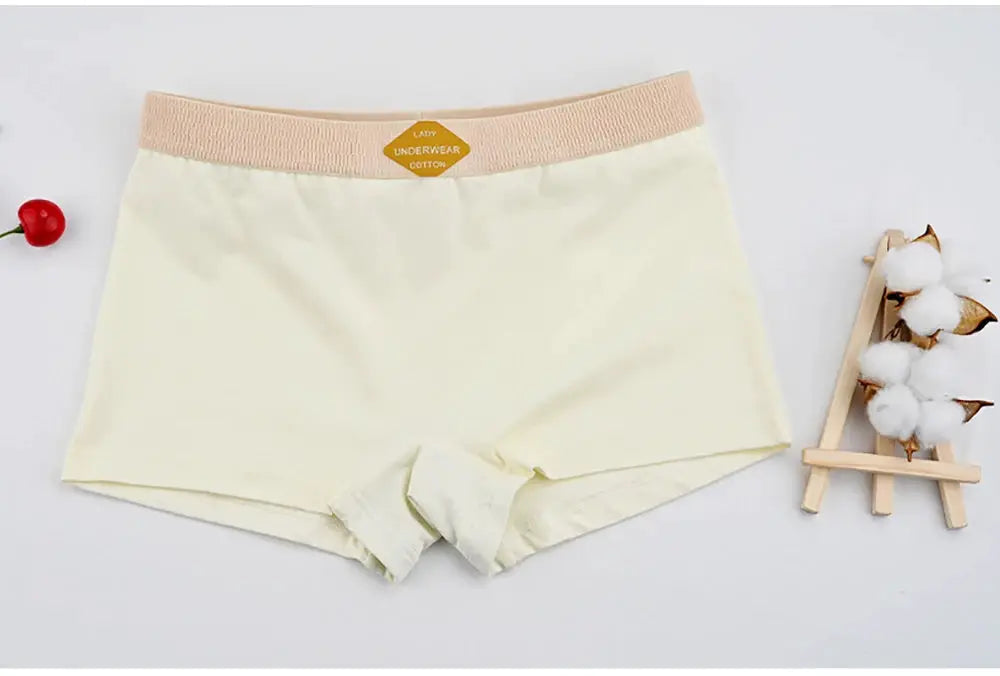 Women's cream cotton boyshorts with beige elastic waistband, mid-rise, breathable