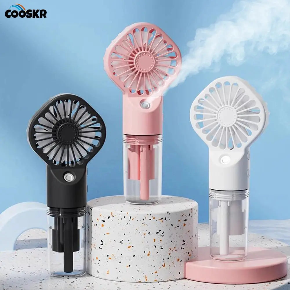 Portable handheld COOSKR spray fan with mist, 3 colors (pink/black/white), USB rechargeable.