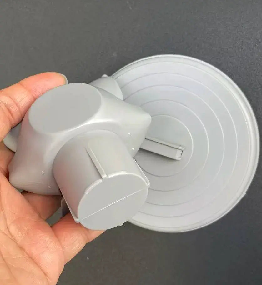 Toilet paper holder in gray plastic with round wall-mount disc