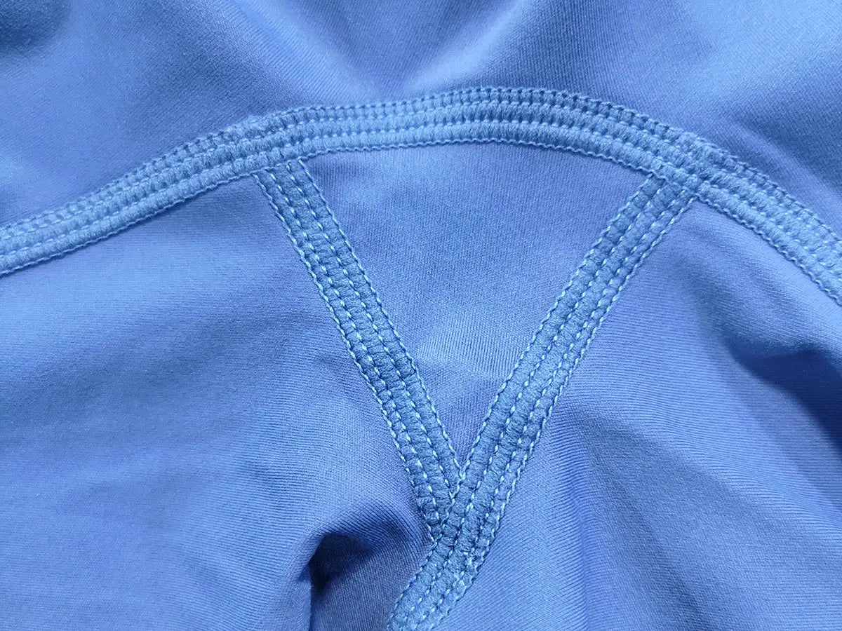 Women's blue athletic shorts with reinforced double-stitch seams