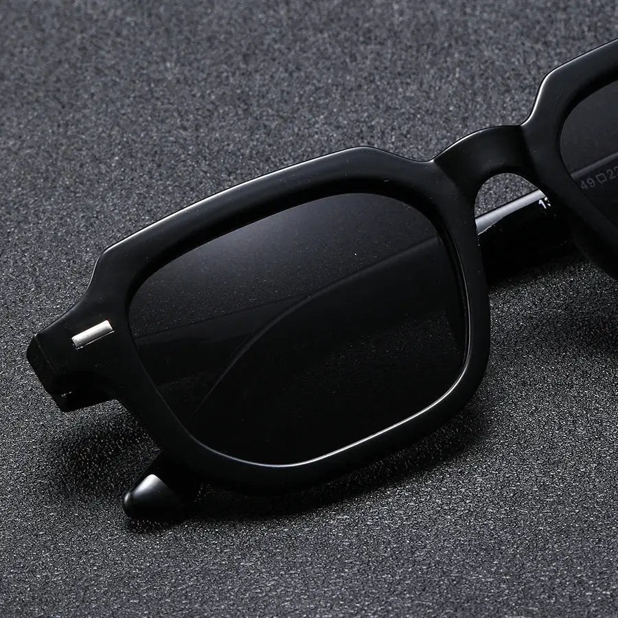 Men's fashion sunglasses, black square frame with retro rivet detail.