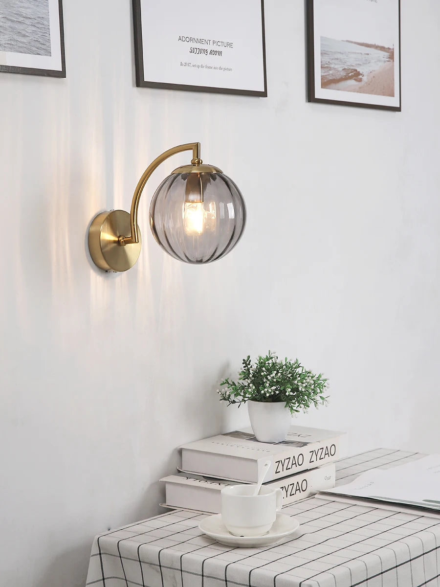 Simples Market modern LED wall lamp with brass curved arm and ribbed glass globe wall sconce.
