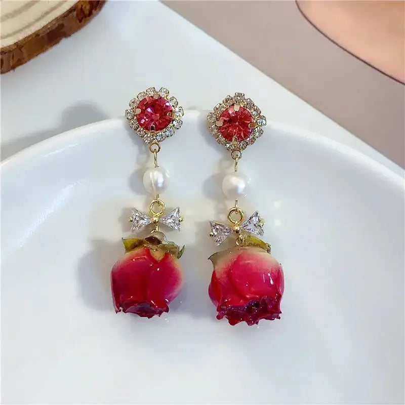 Red rose drop earrings with epoxy resin rose, pearl bead and crystal bow accents (pair)