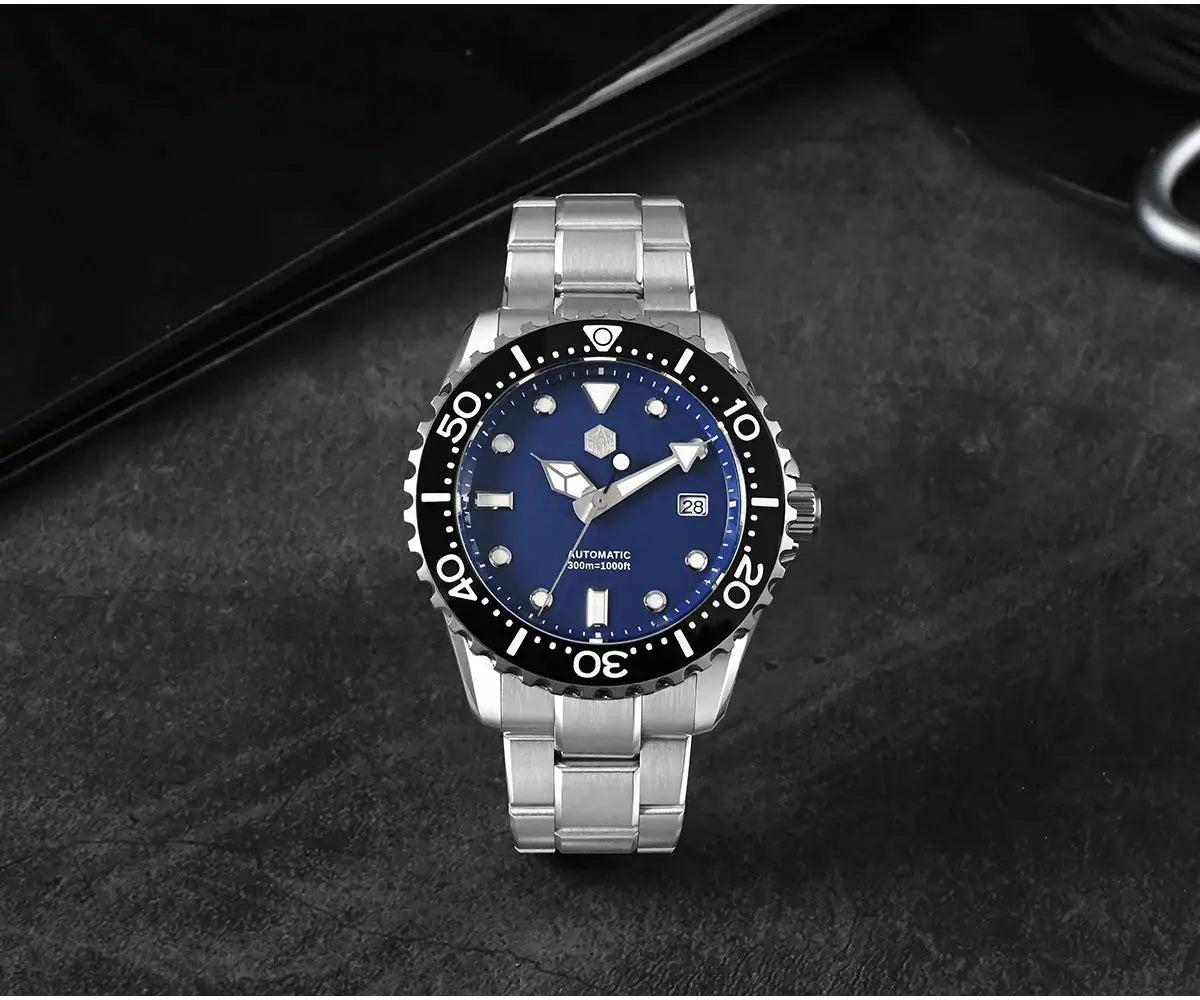 San Martin diver watch, blue dial, stainless steel bracelet, black bezel, date window, automatic NH35 movement.