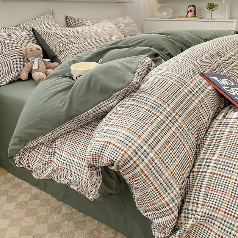 Cotton bedding set with Nordic plaid pattern, green reverse; includes duvet cover, pillowcases and bed sheet set.