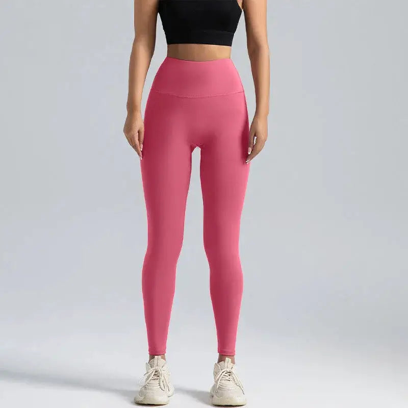 Pink high-waisted women's yoga leggings with abdominal compression
