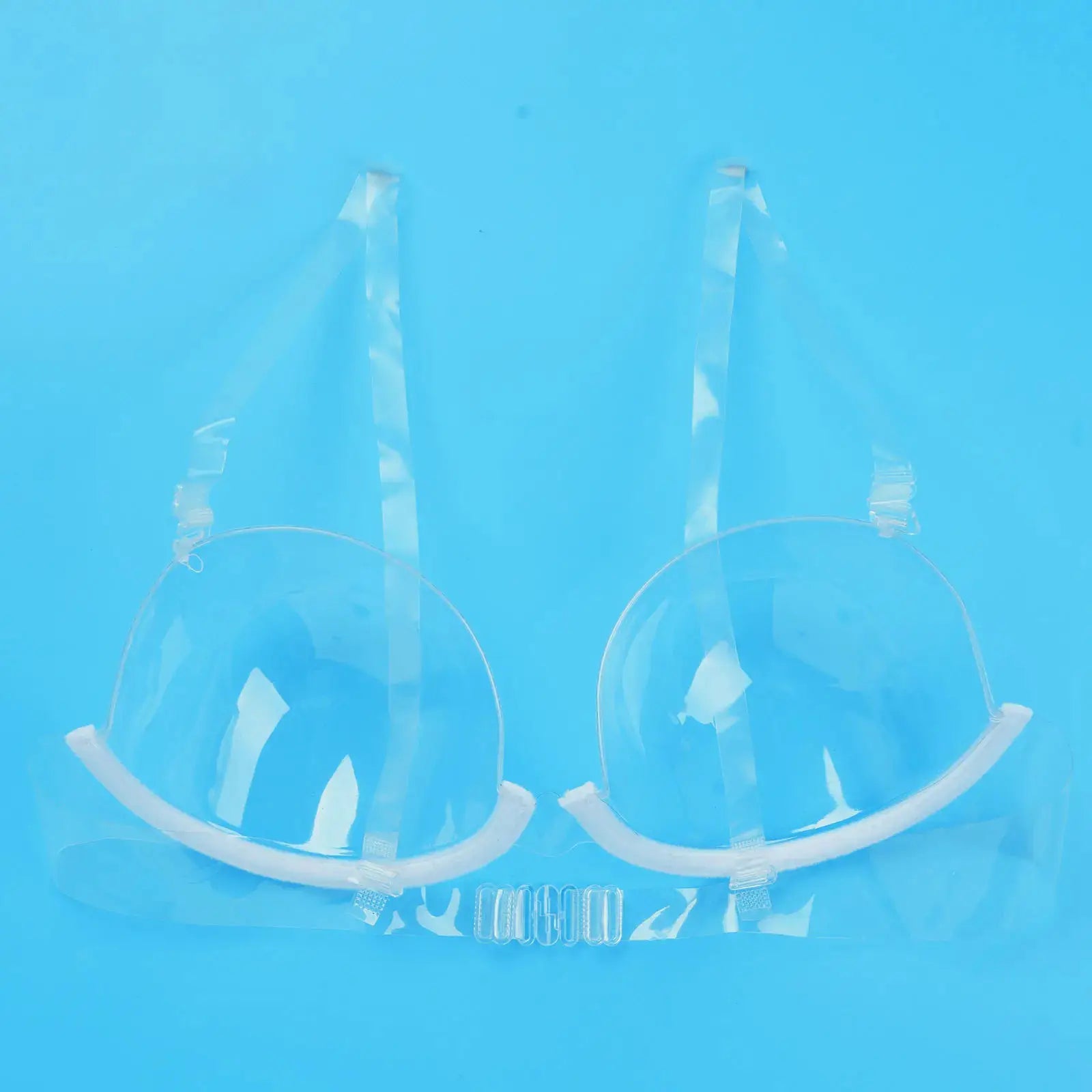 Clear PVC bra top with round cups and transparent straps for nightclub or pole-dance wear