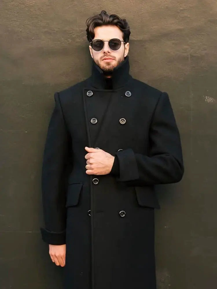 Men's black wool-blend double-breasted long overcoat with high stand collar.