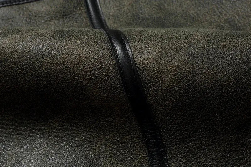 Leather jacket by Simples Market; dark textured leather with a black strap.