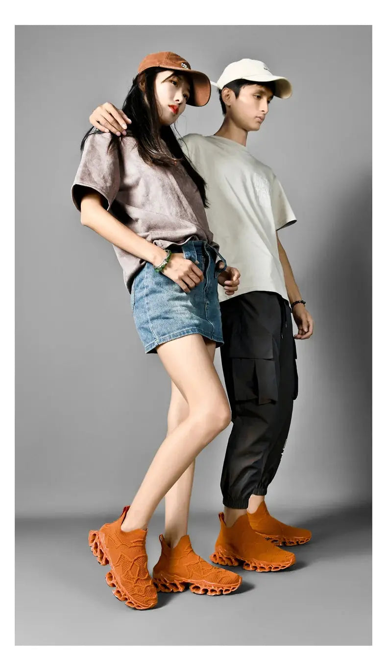 Men's orange knit sneakers with sculpted outsoles; two pairs worn by models