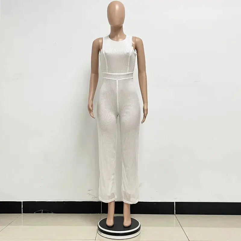 Jumpsuit, white sleeveless with high waist and wide-leg cropped pants.