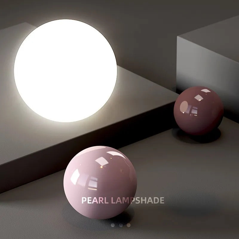 Nordic pendant light with a bright white globe and pink pearl lampshade accents.