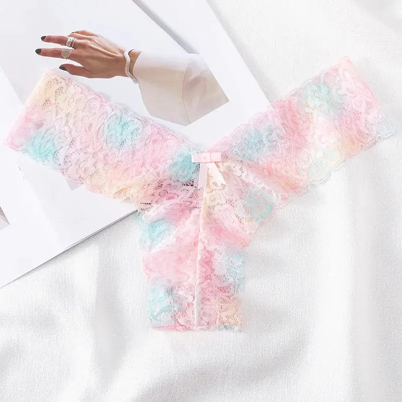 Women pastel rainbow lace thong underwear with bow, seamless T-back design.
