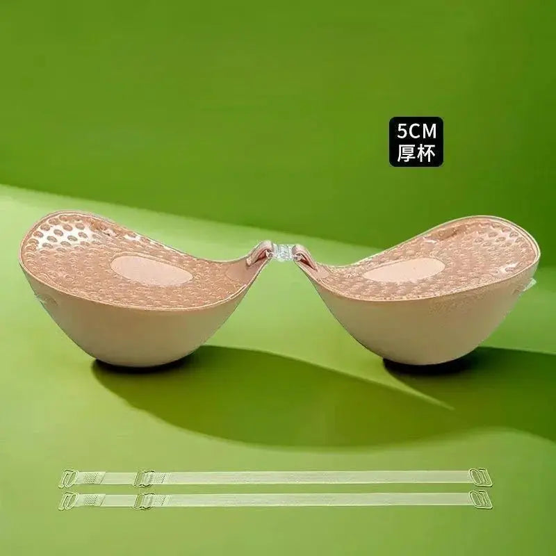 Beige silicone adhesive bra cups connected at front with clear straps; 5cm thick, reusable chest sticker.