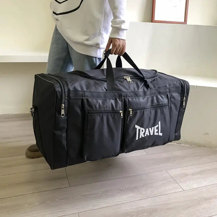 Large capacity travel luggage bag in black with three front zip pockets, multiple compartments, and durable zippers