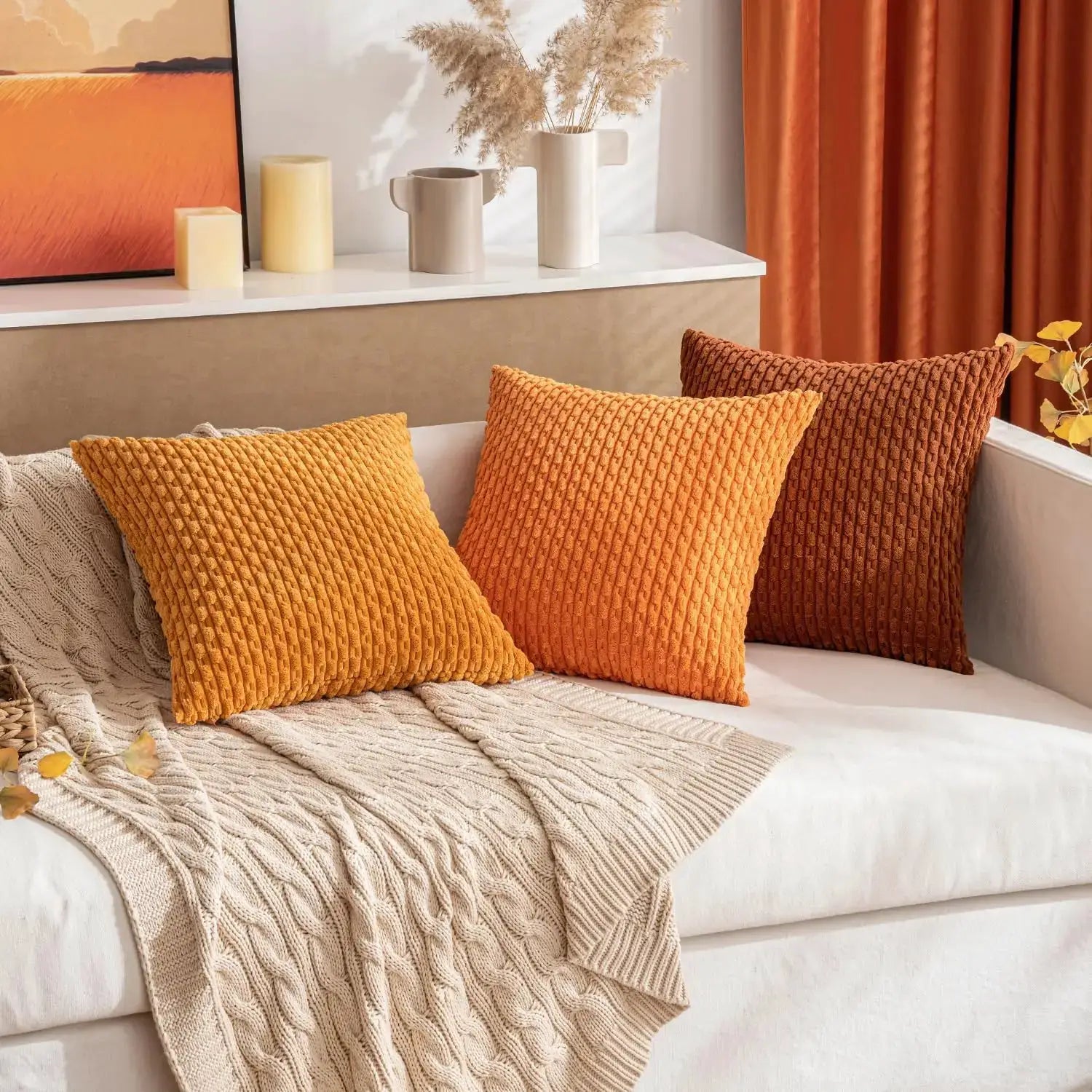 Fall decorative throw pillow covers in soft corduroy; three warm-toned cushions on a beige sofa.