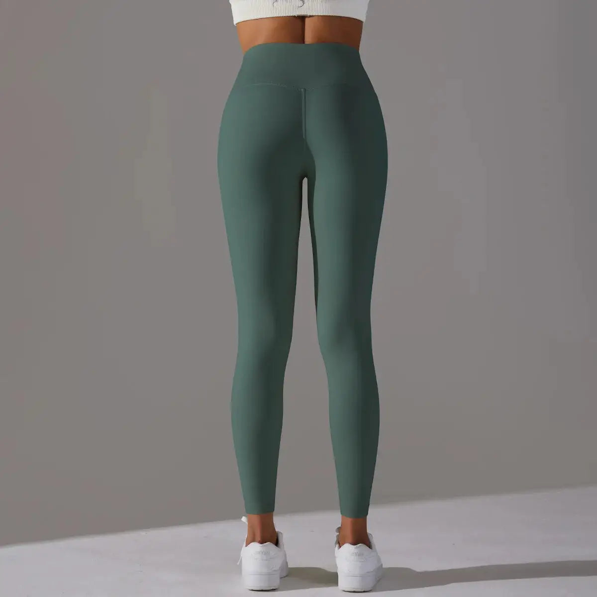 Naked Feeling high-waist leggings by Simples Market, teal green, back view for women's fitness and yoga