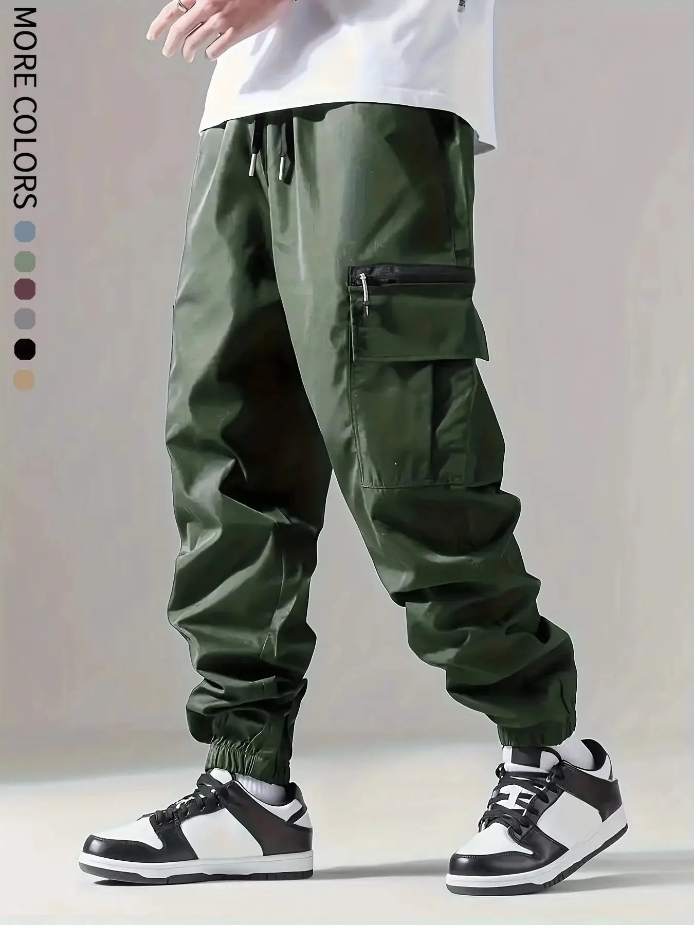 Men's cargo pants by Simples Market in olive green with zippered side pocket and drawstring waist.