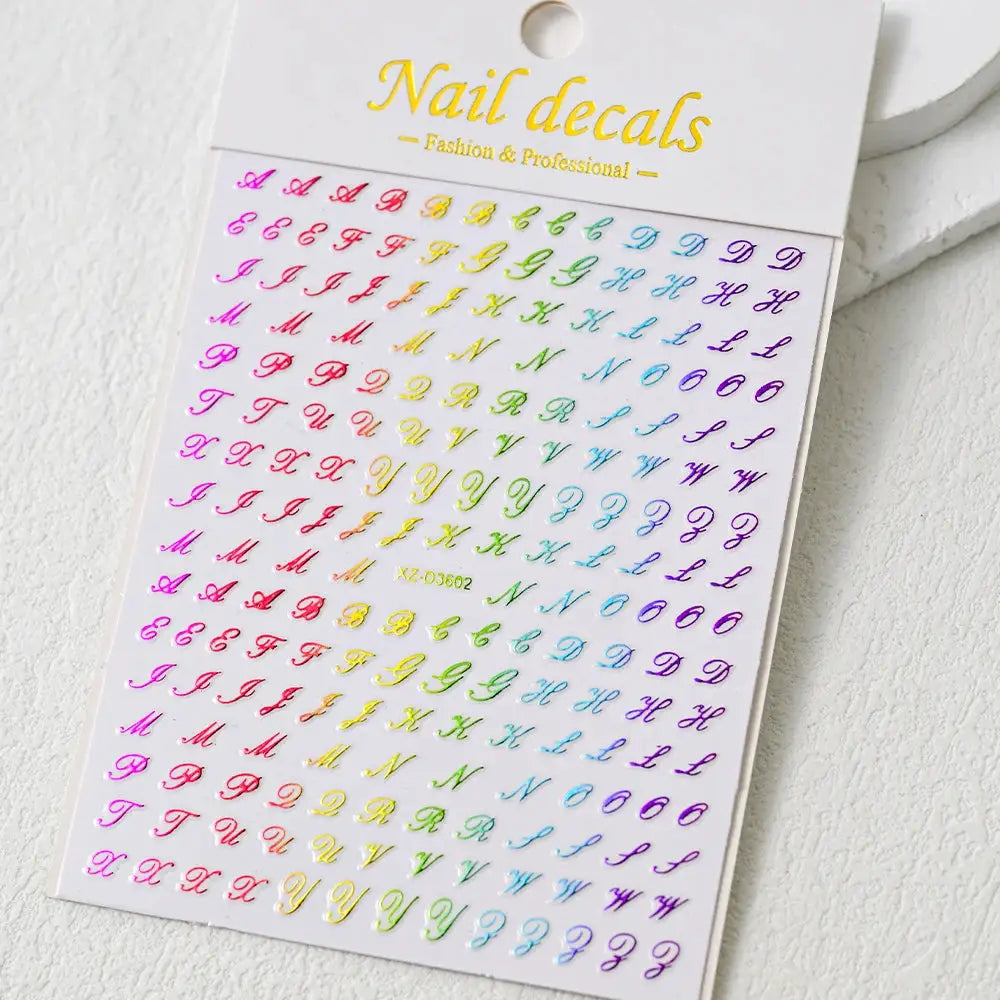 Nail decal sheet with 3D Roman letter stickers in a rainbow gradient for manicures