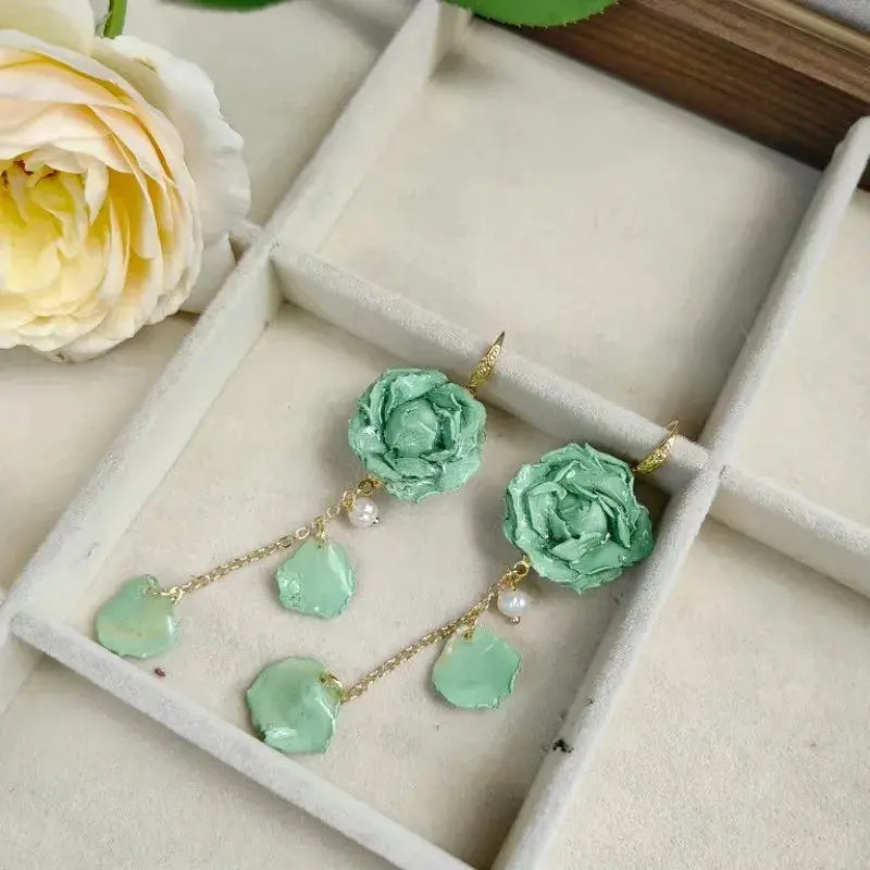 Elegant Immortal Rose Long Earrings pair by Simples Market in teal epoxy resin with real rose petals and pearls