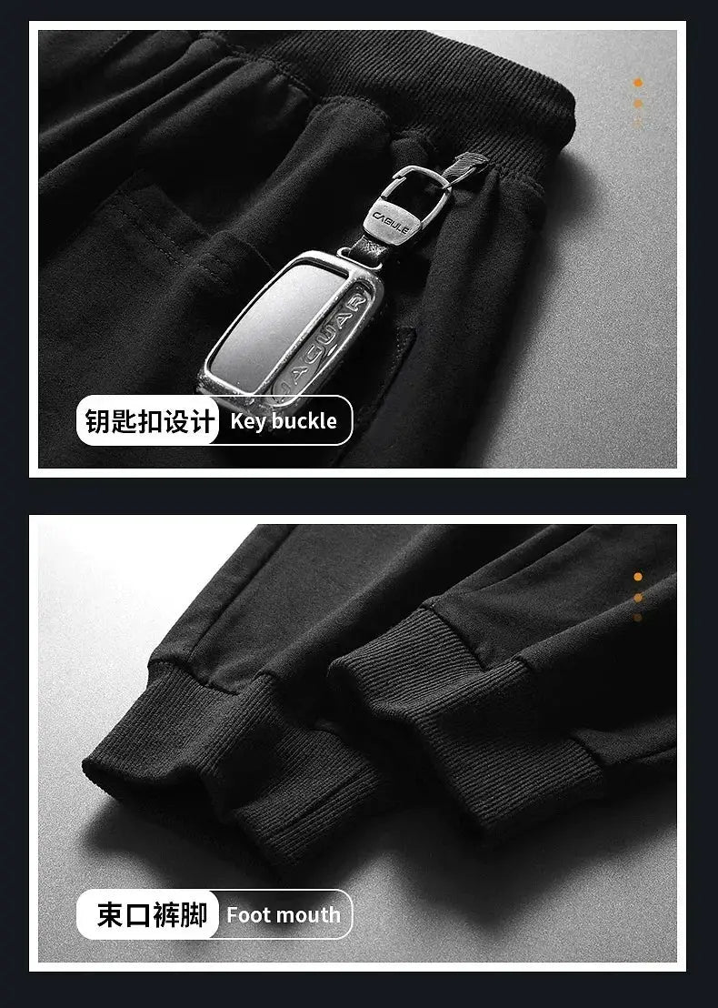 Simples Market men's black fitness jogger pants with elastic waist, metal key buckle, and ribbed cuffs.