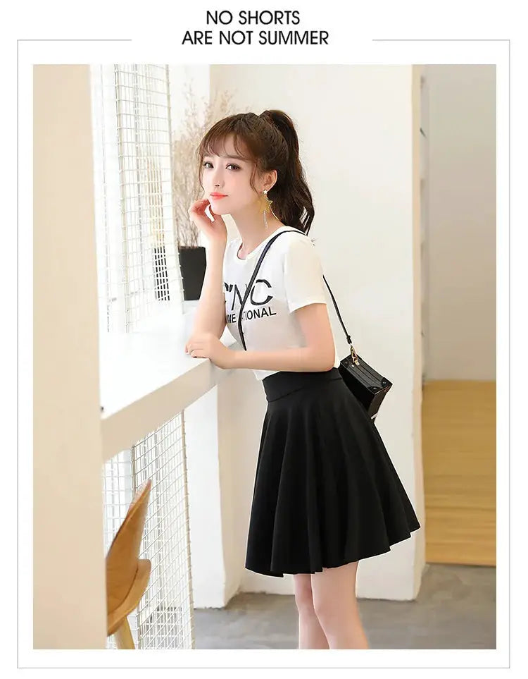 Simples Market black flared pleated mini skirt worn by model