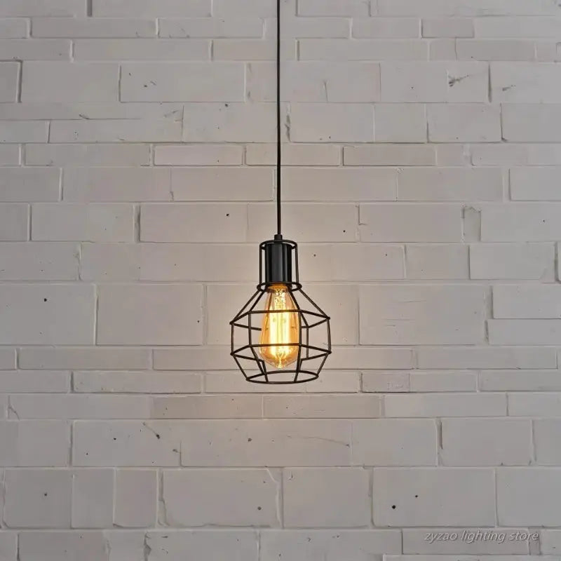 Industrial retro iron pendant light in black with geometric cage and Edison bulb.