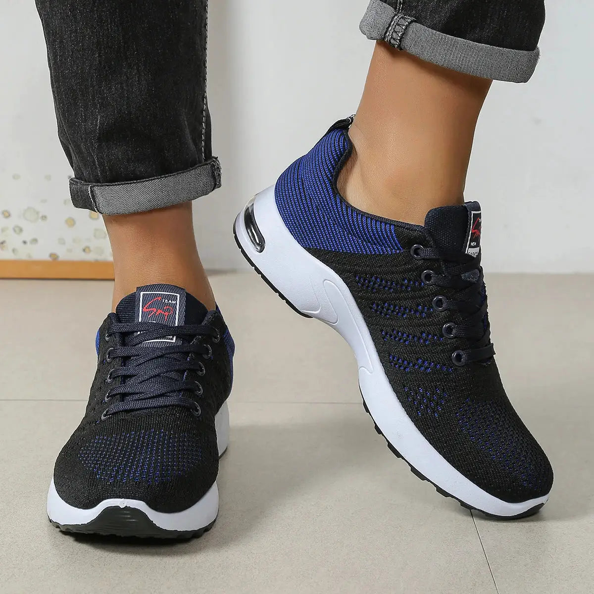 Men's Simples Market lace-up running shoes, black knit upper with blue accents and white sole