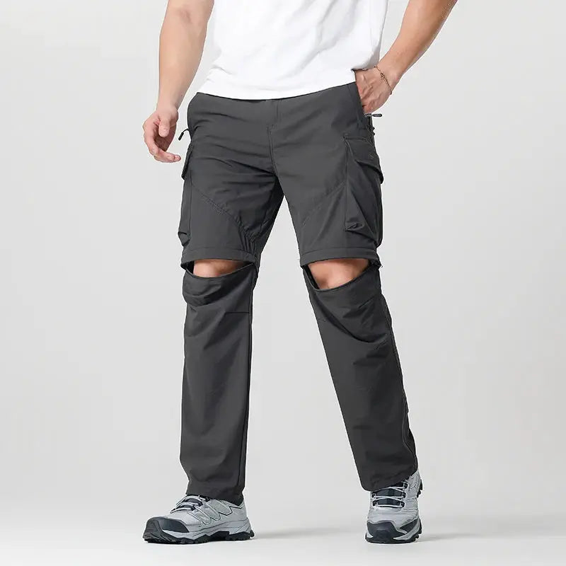 Men's cargo hiking convertible pants, dark gray with knee zip-offs and multiple cargo pockets.