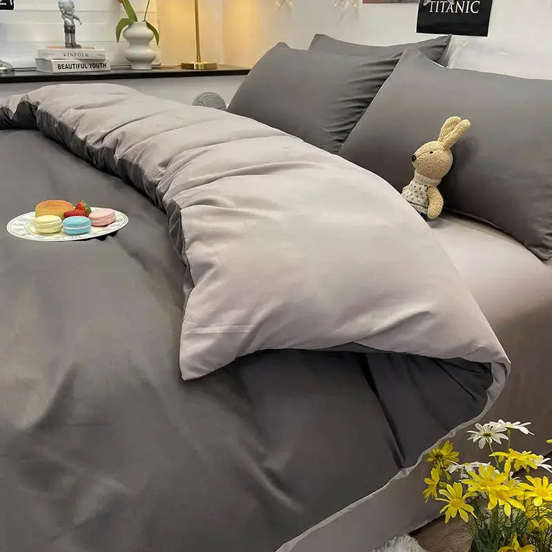 Duvet cover in dark gray for double/queen bed, shown on two-tone gray bedding with a plush bunny