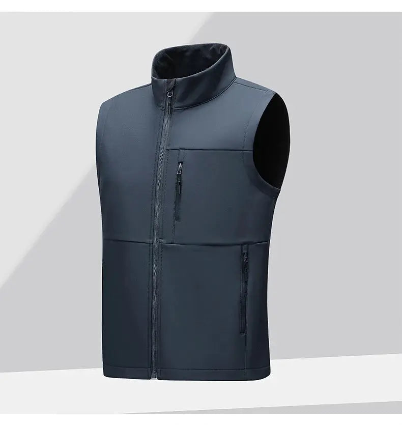 Men's navy soft-shell vest, sleeveless with zip-front, stand collar and multiple zip pockets.