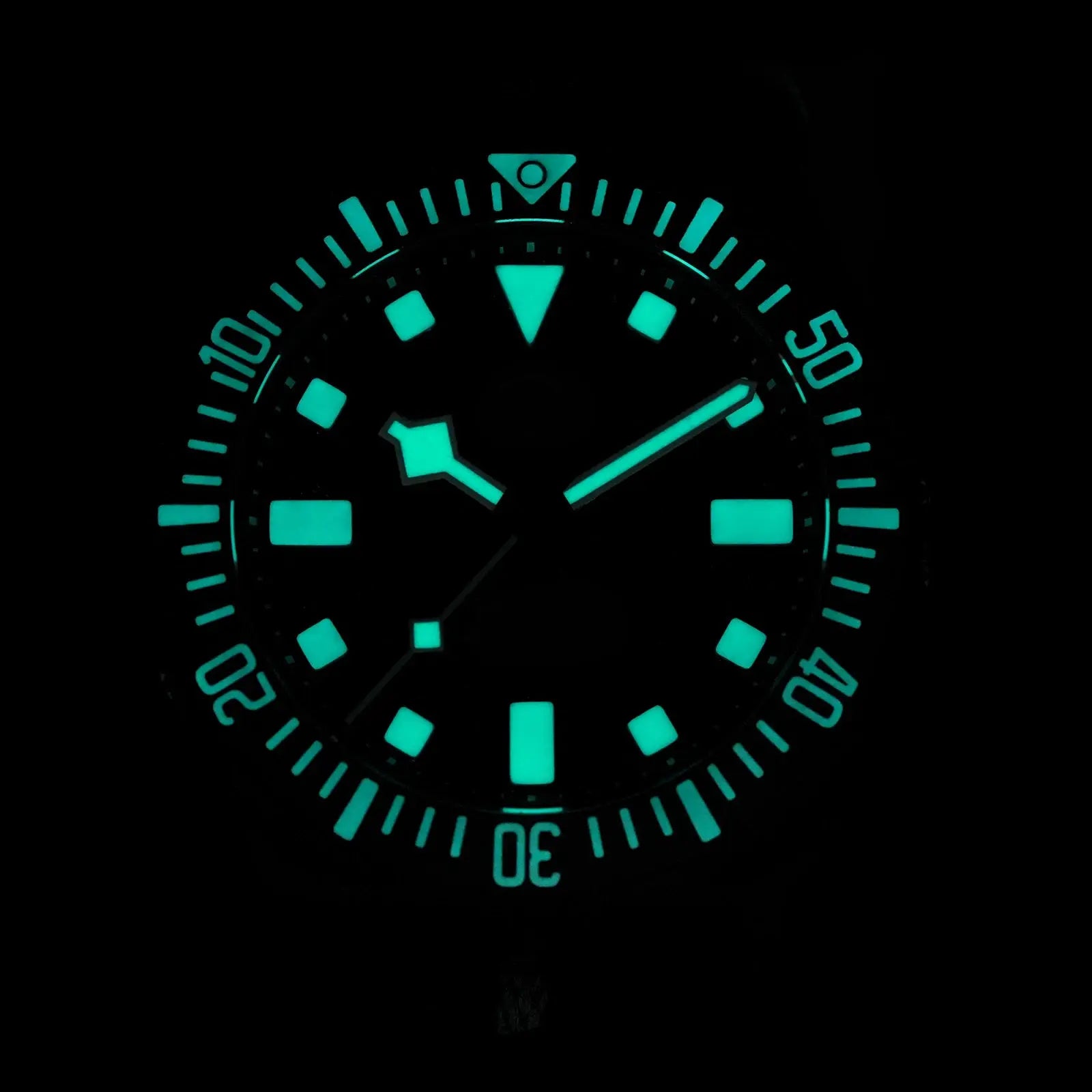 Watchdives EXD 40mm titanium dive watch with teal luminous markers.